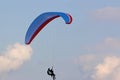 Tandem Paraglider flying in a blue sky Royalty Free Stock Photo