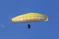 Tandem Paraglider flying in a blue sky Royalty Free Stock Photo