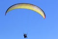 Tandem Paraglider flying wing in a blue sky Royalty Free Stock Photo