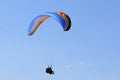 Tandem Paraglider flying wing in a blue sky Royalty Free Stock Photo