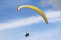 Tandem Paraglider flying in a blue sky Royalty Free Stock Photo