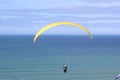 Tandem paraglider flying yellow wing Royalty Free Stock Photo