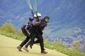 Tandem Paraglider running to Launch Royalty Free Stock Photo