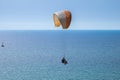 Tandem paragliding above mediterranean sea