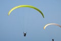 Tandem paragliding above mediterranean sea on blue sky