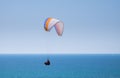 Tandem paragliding above mediterranean sea on blue sky