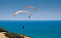 Tandem paragliding above mediterranean sea Royalty Free Stock Photo