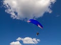 Tandem paragliding in the blue skies.