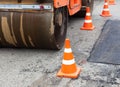 Tandem road roller and traffic cones on the road construction Royalty Free Stock Photo