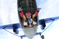 Tandem Skydiving. Active Woman Are Jumping Out Of A Plane.