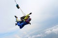 Skydiving. Tandem jump. Instructor and indian passenger. Royalty Free Stock Photo