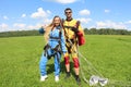 Tandem skydiving. Instructor with sexy girl.