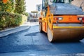 Tandem vibration roller compactor working on asphalt pavement Royalty Free Stock Photo