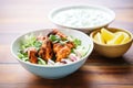 tandoori chicken served beside cucumber raita in a bowl Royalty Free Stock Photo