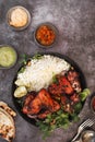 Tandoori chicken wings served with pilau rice