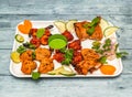 tandoori platter with tandoori chicken , tikka kabab, and grilled prawn with onion and lemon served in dish isolated on wooden Royalty Free Stock Photo