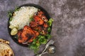 Tandoori spiced chicken wings served with pilau rice