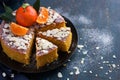 Tangerine and almond cake on dark blue background, Royalty Free Stock Photo