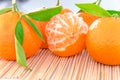 Tangerine or clementine with green leaf isolated