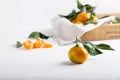 Tangerine clementine, mandarin, citrus fruit with green leaf on white table Royalty Free Stock Photo