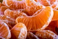 Tangerine or mandarin orange segments peeled close up background texture. Royalty Free Stock Photo