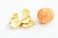 Tangerine orange and peel out with drop of water on white background
