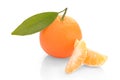 Tangerine with slices and leaves on a white background