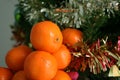 Tangerines on the background of the Christmas tree