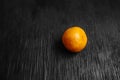 Tangerines on a black background. Lots of fresh fruit - mandarins. Royalty Free Stock Photo