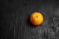 Tangerines on a black background. Lots of fresh fruit - mandarins. Royalty Free Stock Photo