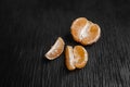 Tangerines on a black background. Lots of fresh fruit - mandarins. Royalty Free Stock Photo