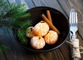 Tangerines bright orange ripe with green leaves on a gray plate with fir branches on the wooden table. table setting for Christmas Royalty Free Stock Photo