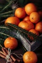 Tangerines With Christmas Decoration On Rustic Wooden Background. Tangerines With Spruce. Christmas Decoration