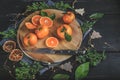 Tangerines on a festive Christmas rustic table setting with vintage dishes on a dark background Royalty Free Stock Photo
