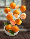 Tangerines flying over white bowl Royalty Free Stock Photo