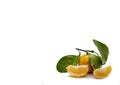 Tangerines fruits with mandarin leaves and slices isolated on a white background Royalty Free Stock Photo