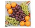 Tangerines and grapes in a bowl Royalty Free Stock Photo