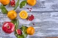 Tangerines with leaves on a wooden background Royalty Free Stock Photo