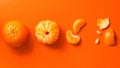 Tangerines on an orange background: whole, peeled, wedges and peels. Flat lay. Banner Royalty Free Stock Photo