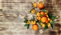 Tangerines oranges, mandarins, citrus fruits with leaves in basket over rustic wooden background Royalty Free Stock Photo