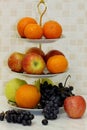 Tangerines, oranges, red and green apples and grapes Royalty Free Stock Photo