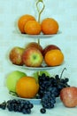 Tangerines, oranges, red and green apples and grapes Royalty Free Stock Photo