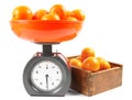 Tangerines on scales and in a box Royalty Free Stock Photo