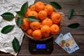 Tangerines on scales in shop Royalty Free Stock Photo