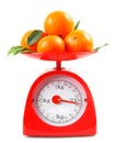 Tangerines on scales Royalty Free Stock Photo