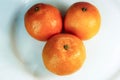 tangerines. tangerines close up on white background. citrus. tropical fruits. three sweet fragrant delicious tangerines