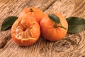 Tangerines three fruits on wooden background. Vintage still life toned image Royalty Free Stock Photo