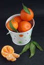 Tangerines in white bucket Royalty Free Stock Photo