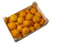 Tangerines in a wooden box. Isolated white background Royalty Free Stock Photo