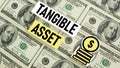 Tangible asset is shown using the text and photo of dollars Royalty Free Stock Photo